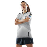 Woman with arms crossed wearing white Good Times Billiards team jersey, front view